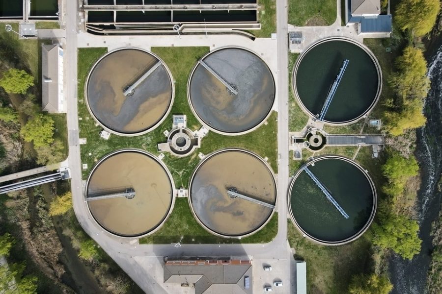 Aerial top view of round polls in wastewater treatment plant, filtration of dirty or sewage water. High quality photo